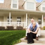 couple in front of home