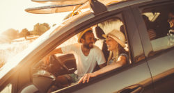 young adults in car laughing